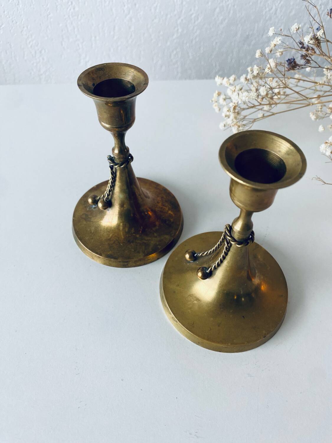Pair of brass cord candle holders