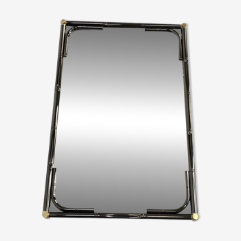 Mirror in black metal and brass with gunmetal finish