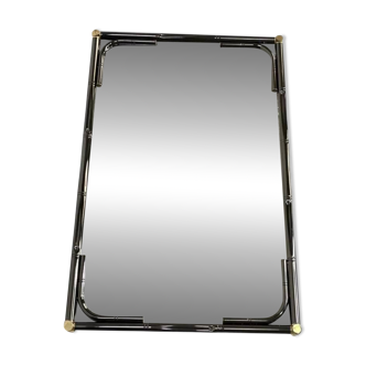 Mirror in black metal and brass with gunmetal finish