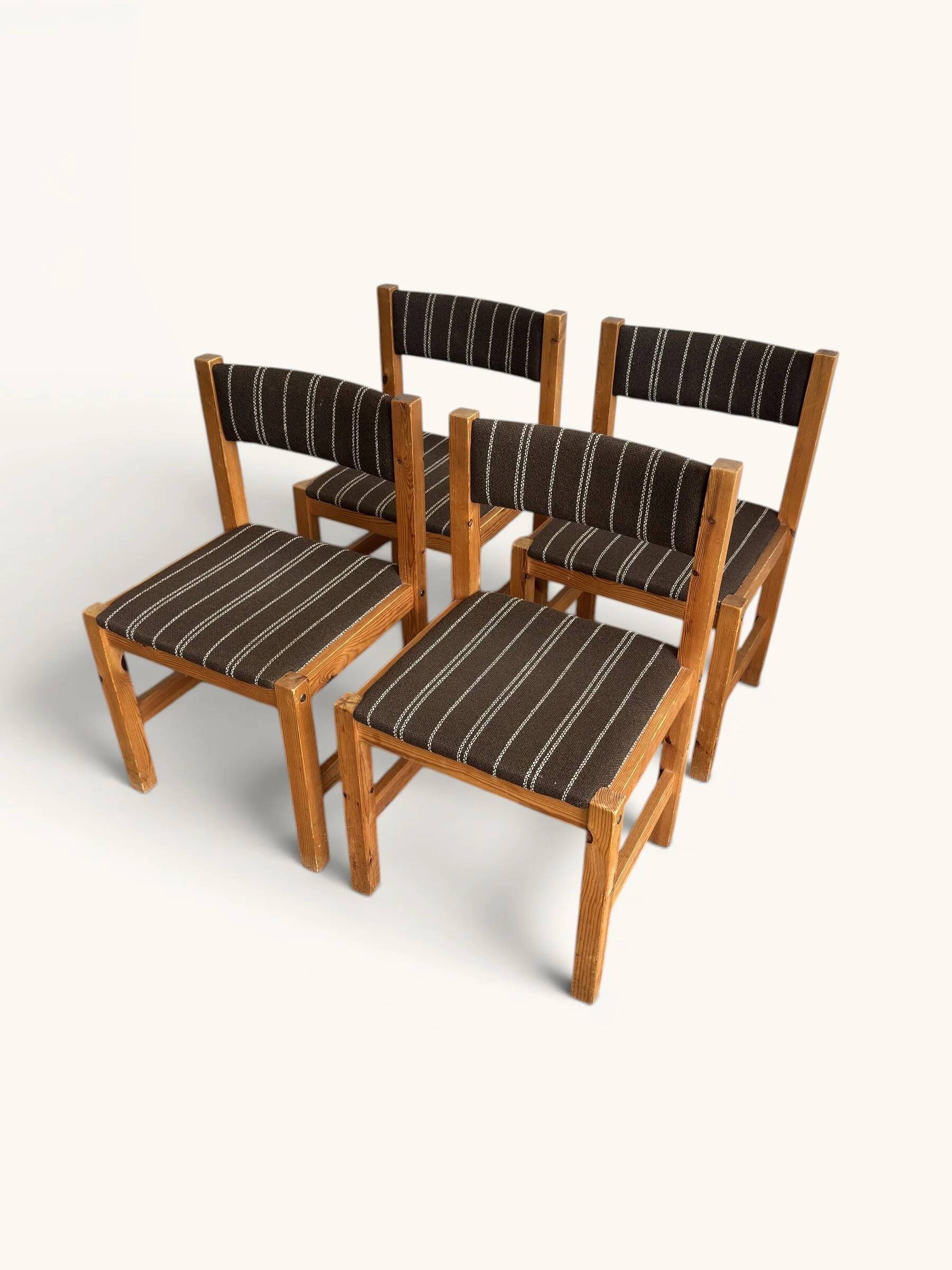 Set of 4 Danish dining chairs with brown striped upholstery.