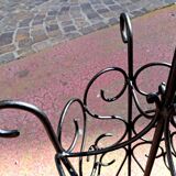 Antique wrought iron umbrella stand for entrance hall, vintage decor.