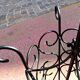 Antique wrought iron umbrella stand for entrance hall, vintage decor.