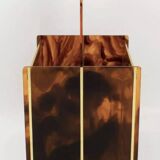 Tortoiseshell lucite magazine rack from the Christian Dior Home collection.