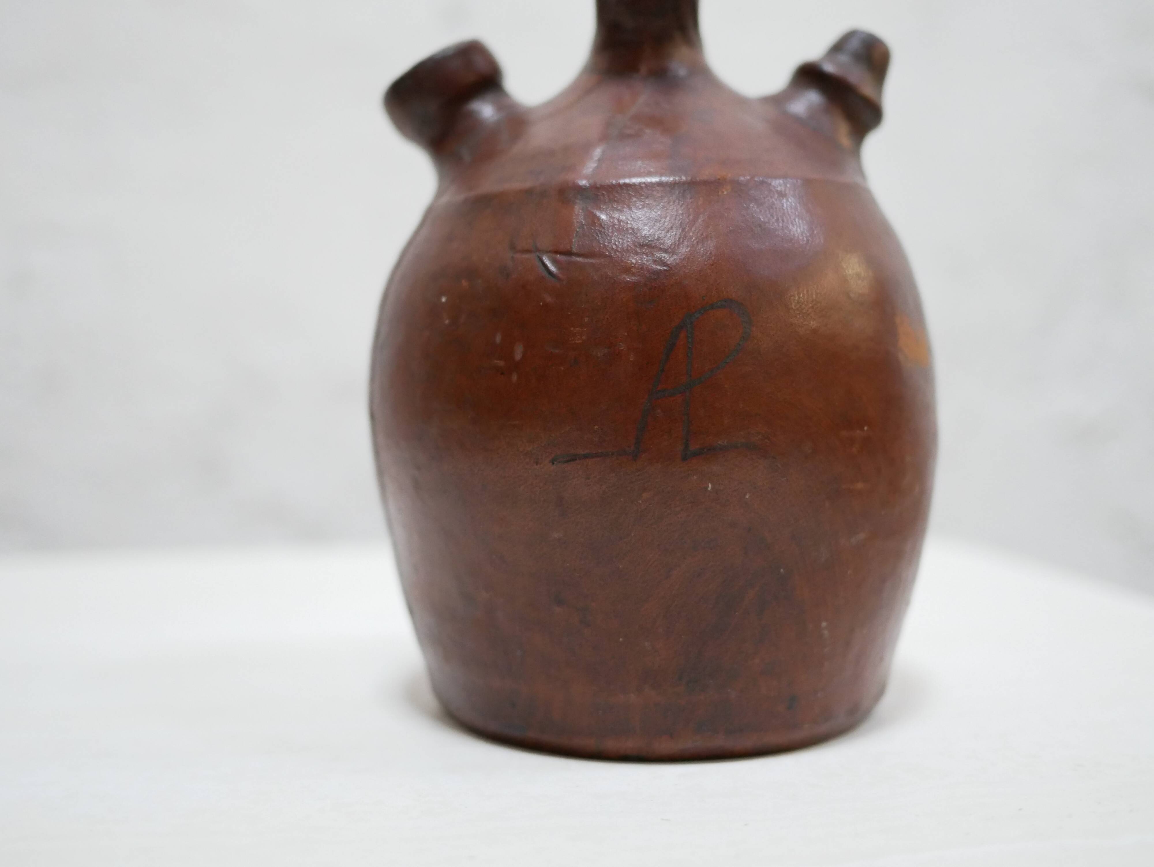 Vintage leather gargoulette pot