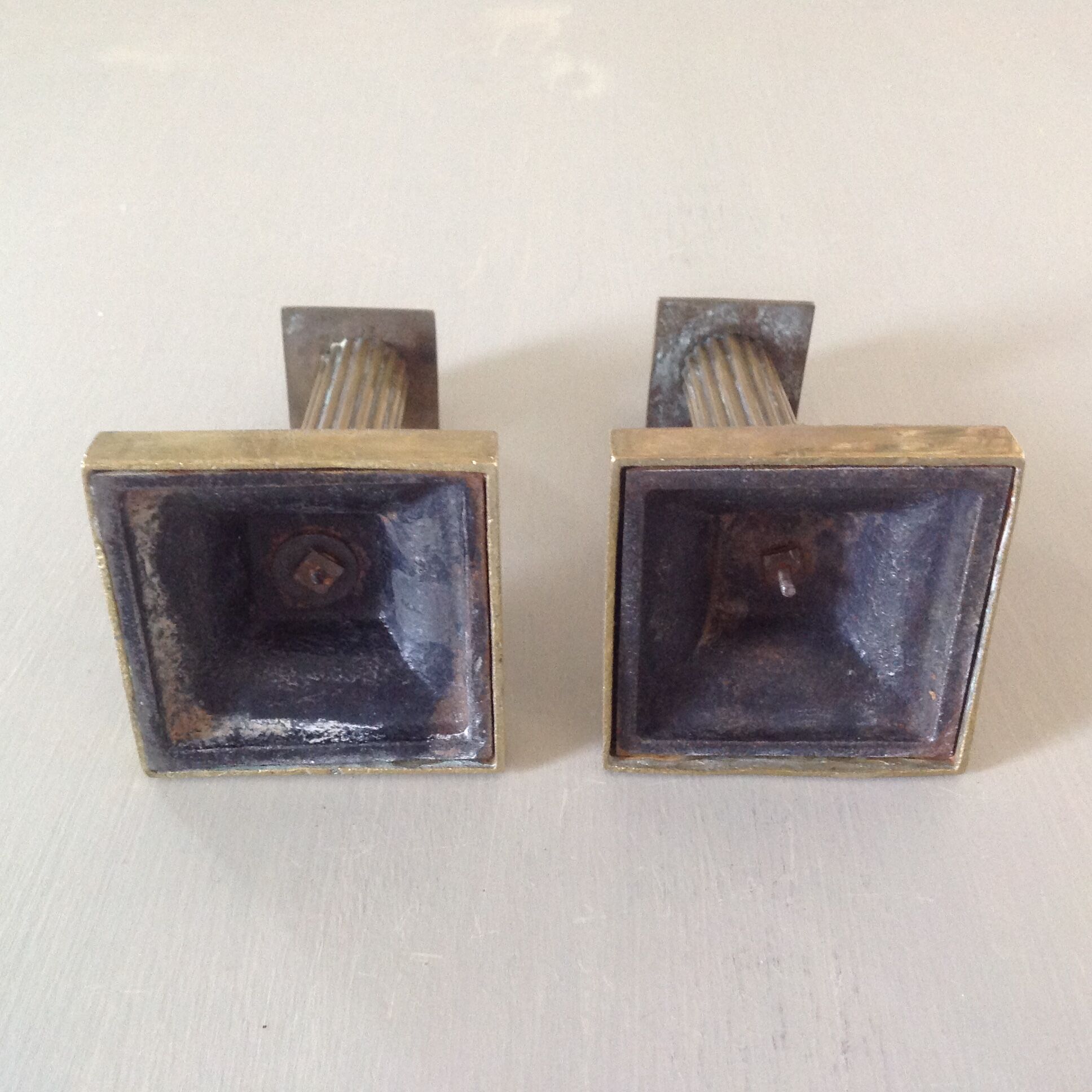 Duo of bronze candlesticks