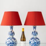 Pair of Royal Delft blue and white ceramic table lamps with new vermilion silk shades.