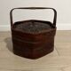 Ancient wooden and woven wicker basket,