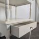 White side table with a painted finish.