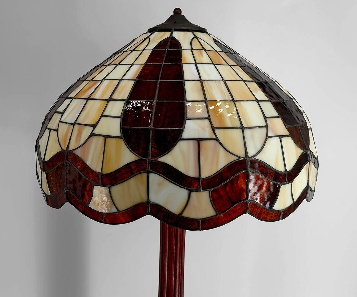 Art Deco floor lamp in carved walnut, stained glass shade, France, c. 1920
