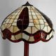 Art Deco floor lamp in carved walnut, stained glass shade, France, c. 1920