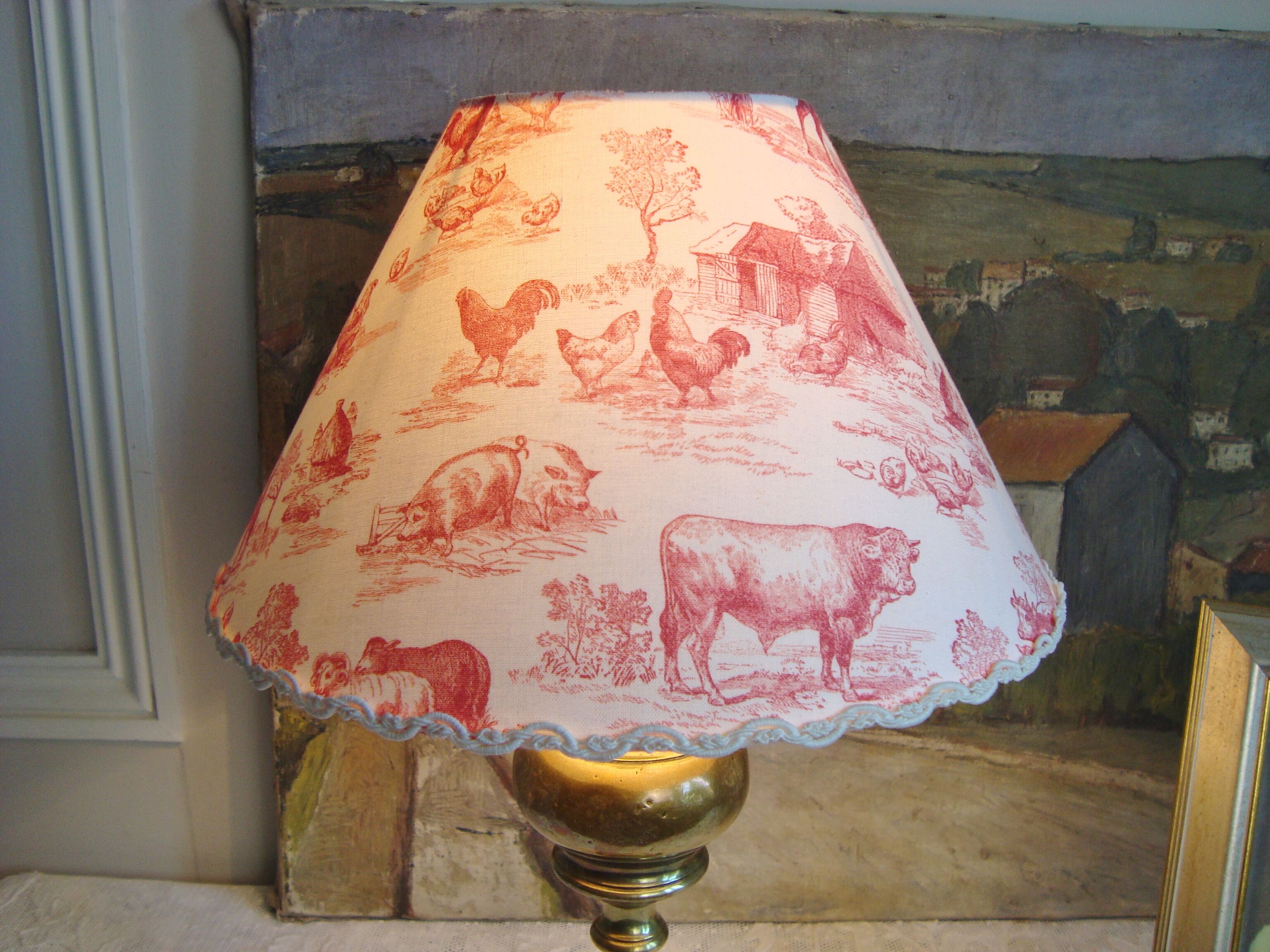 Ancient brass lamp with its youthd shade motifs farm animals