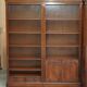 Corner library made of flamed hardwood, in 3 parts.