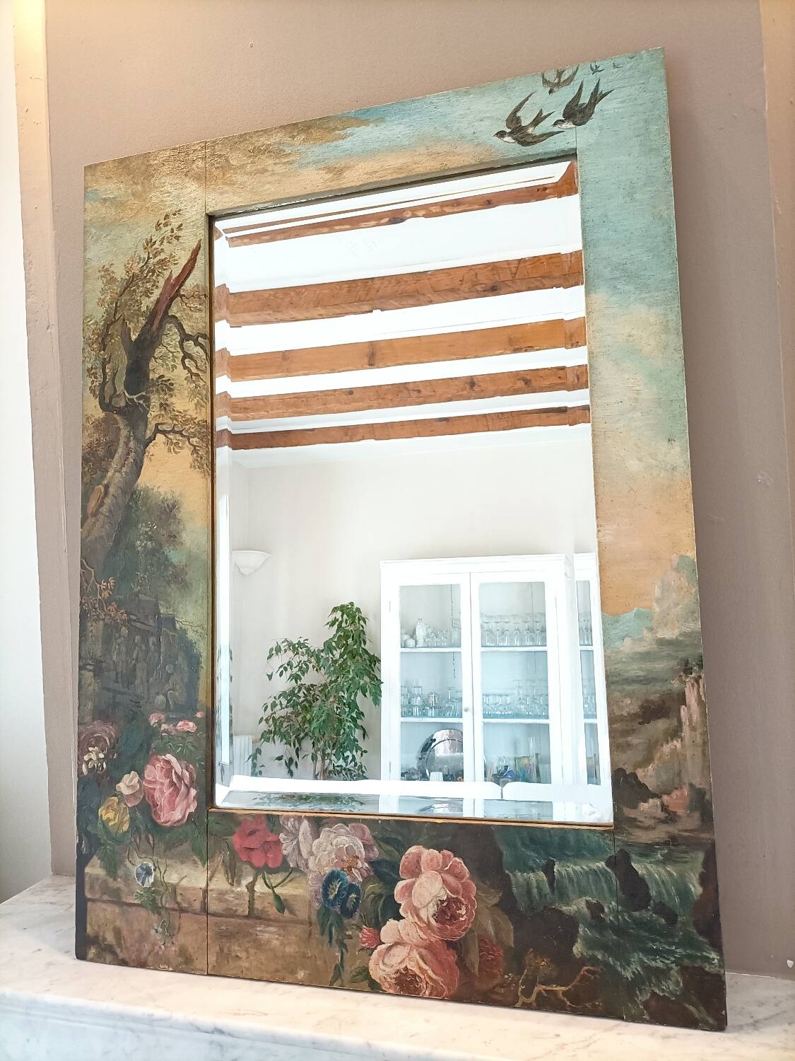 Very large mirror painted in Victorian style.