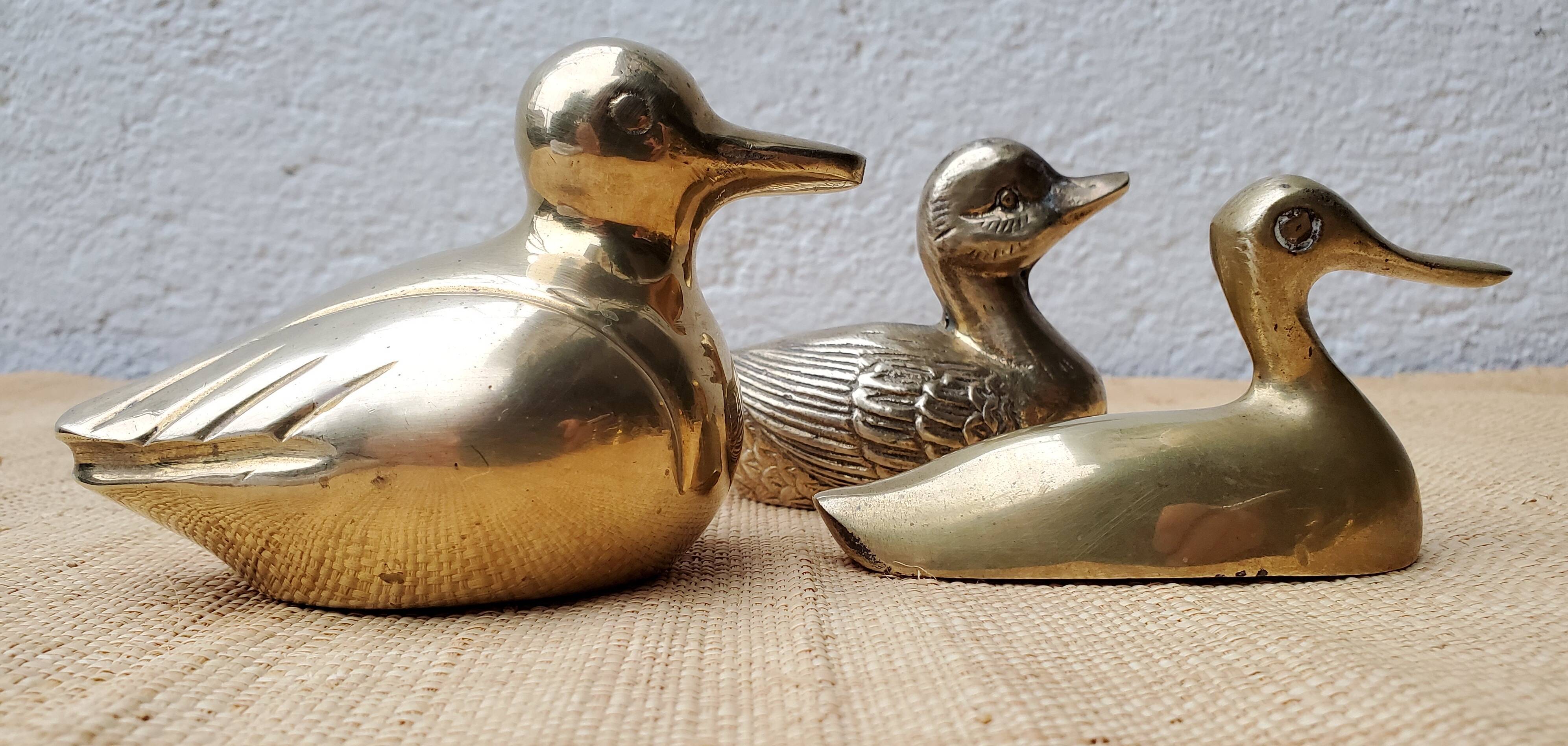 Trio of brass ducks