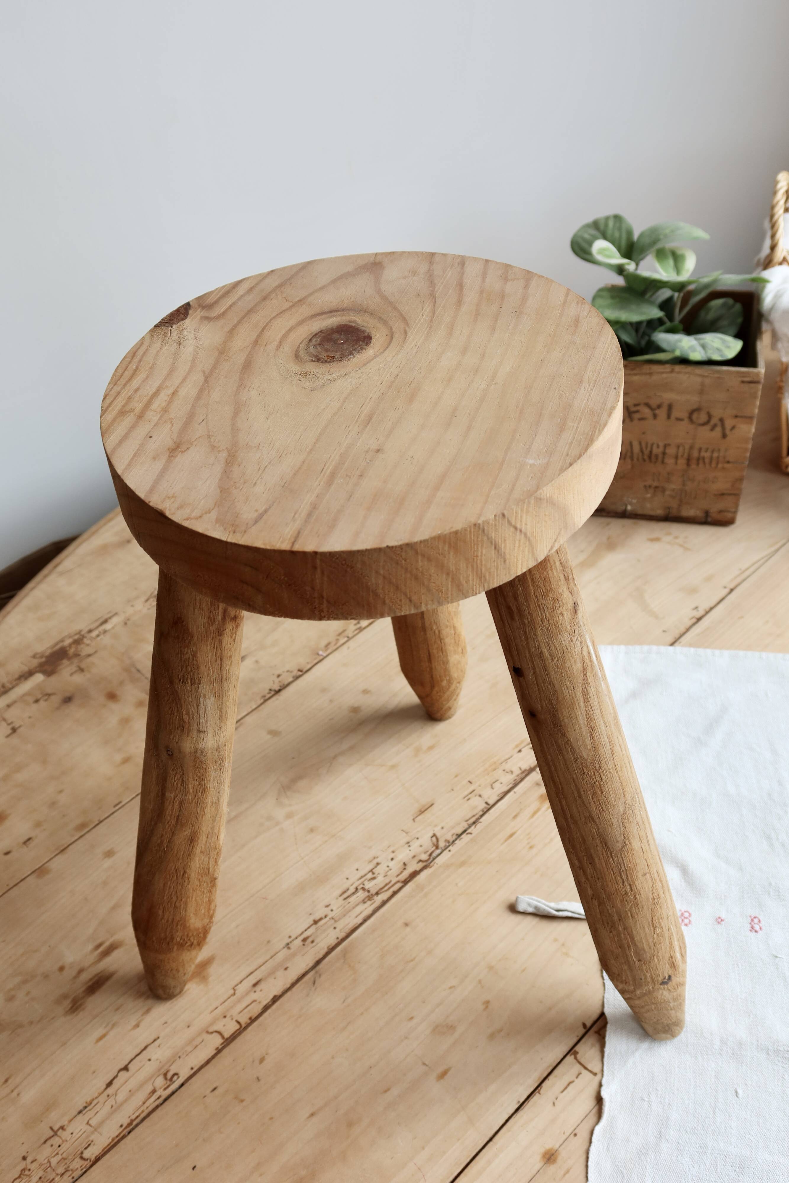 Vintage tripod stool in light raw wood