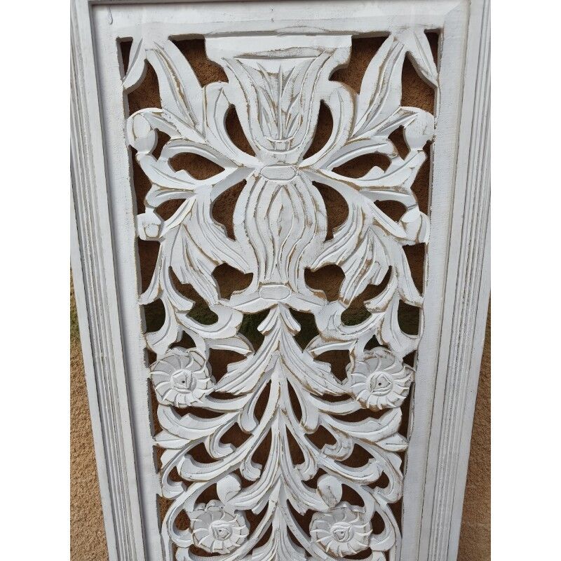 Decorative wooden panel with carved and openwork design.