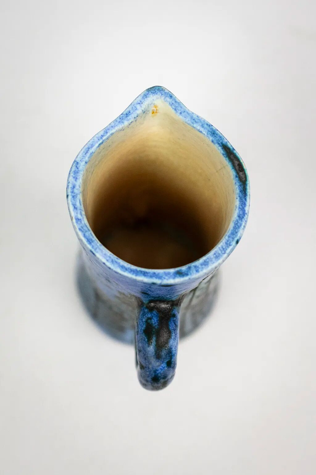 Small jug by Jacques Blin in blue ceramic with engraved animal decoration.