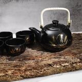 Japanese tea service, teapot and 6 cups, black, gold pattern.