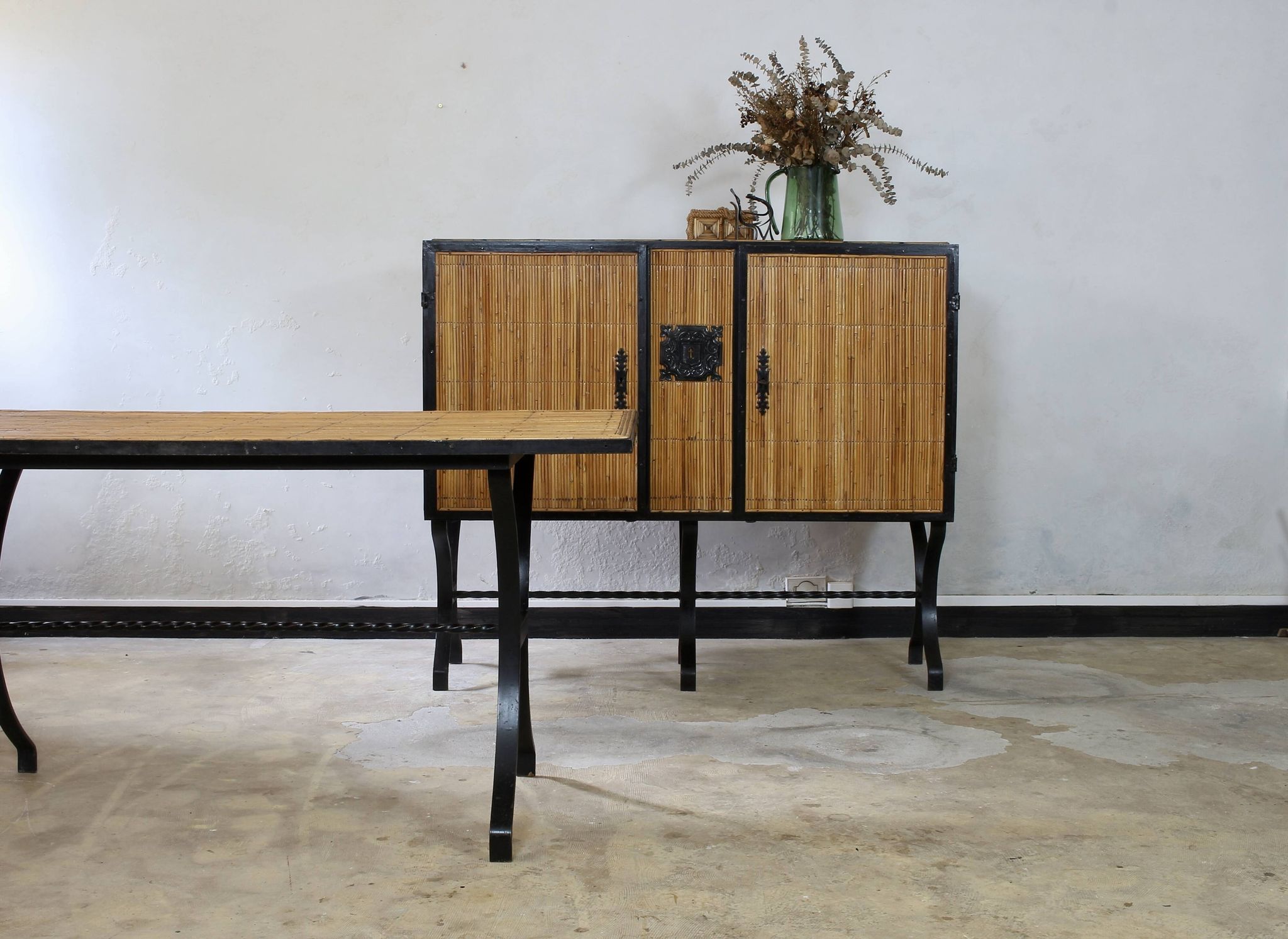 Dining table in rattan and wrought iron similar to Audoux & Minet.