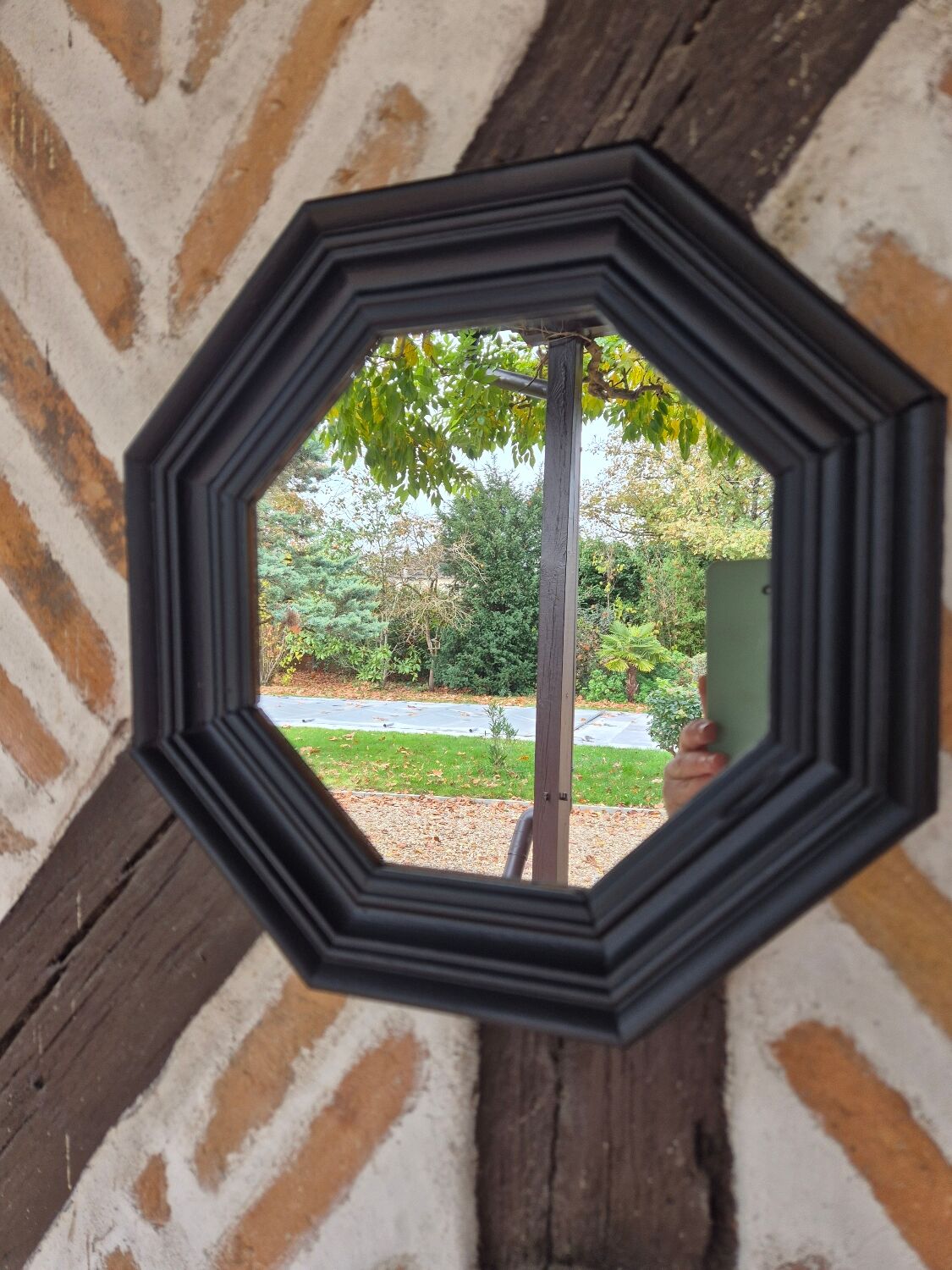 Octagonal black wood mirror