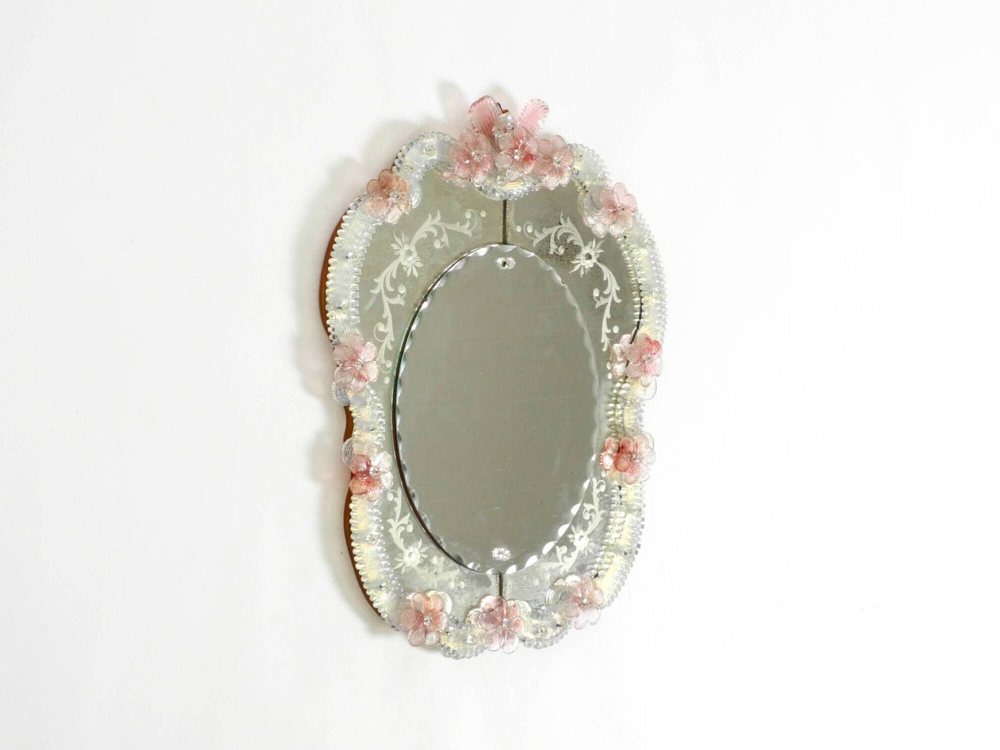 Italian mid-century wall mirror with a Murano glass frame and blossoms