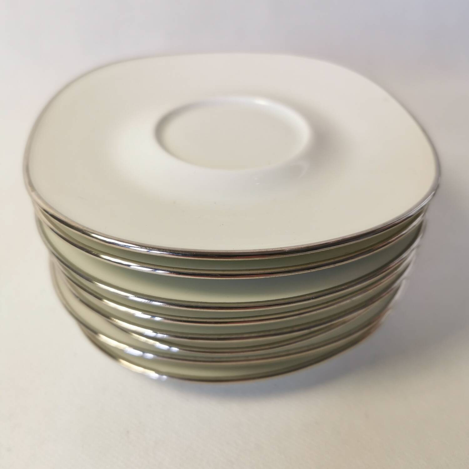 Set of 8 Georges Boyer Limoges porcelain saucers