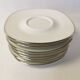 Set of 8 Georges Boyer Limoges porcelain saucers