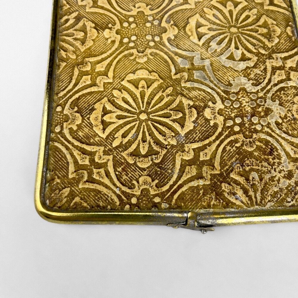 Old barber mirror in brass and beveled glass
