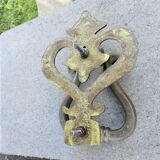 Impressive door knocker from the High Middle Ages in solid bronze.