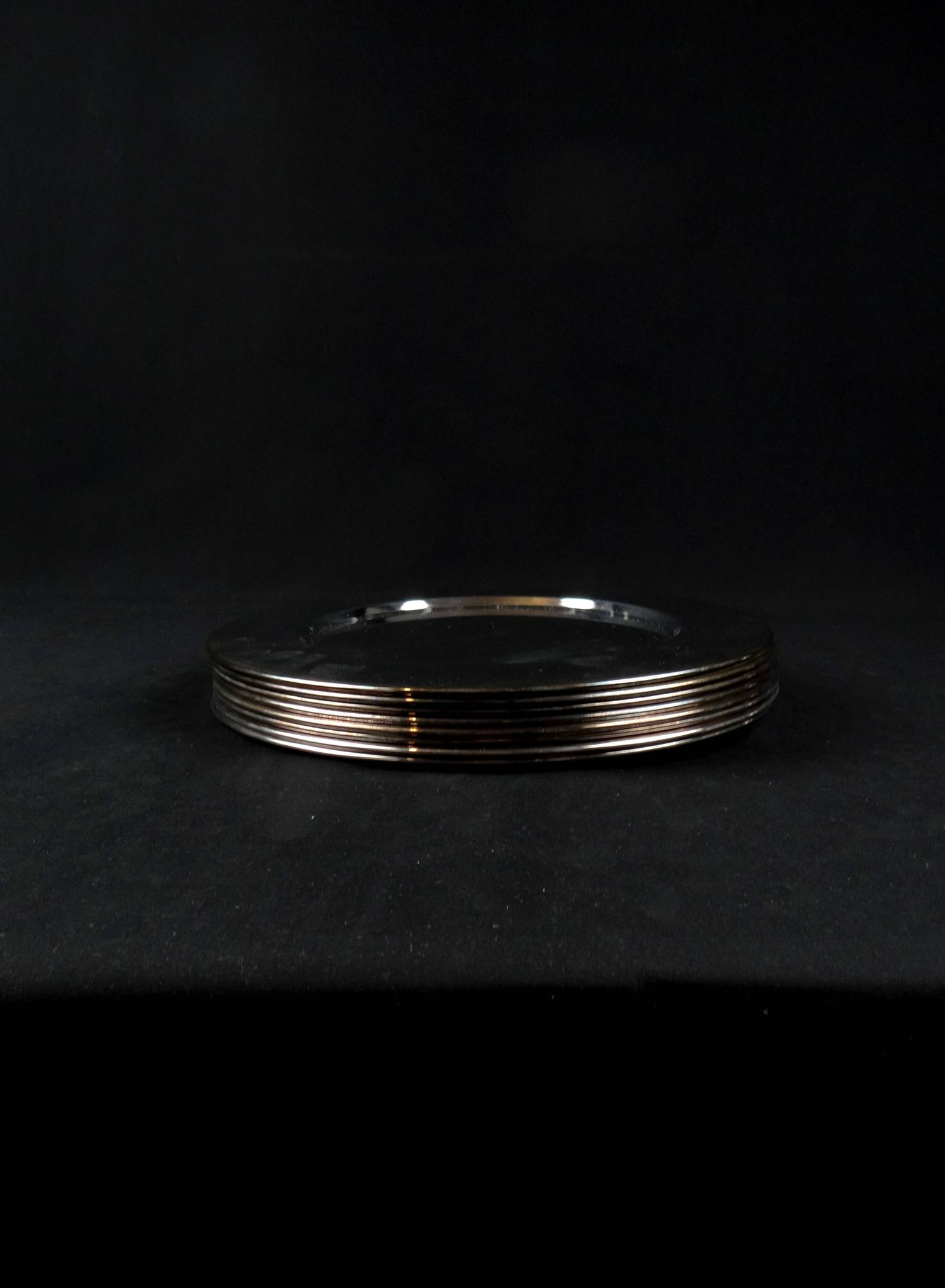 Set of 8 round serving platters or saucers in vintage stainless steel