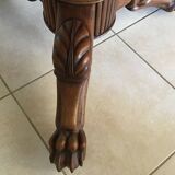 Wooden gueridon with marble, lion paw legs.