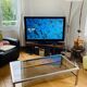 1970s coffee table in brushed metal, brass and smoked glass by Willy R