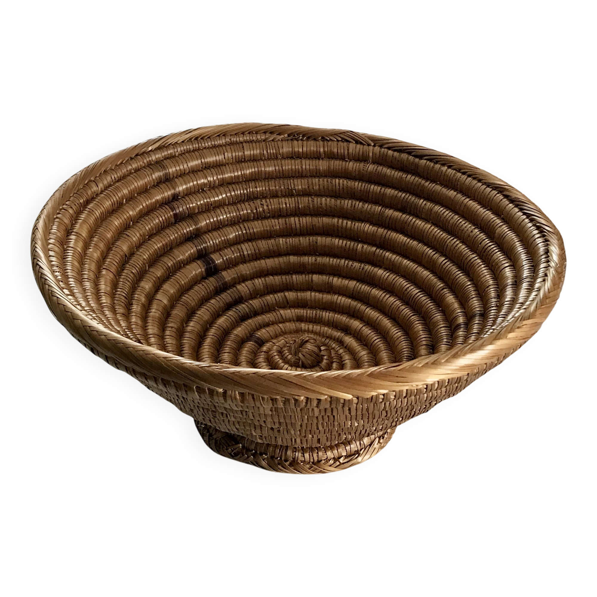 Large bowl on a woven wicker stand