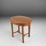 Timeless French Art Deco carved oval side table in oak, 1930s