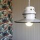 Enamelled metal suspension