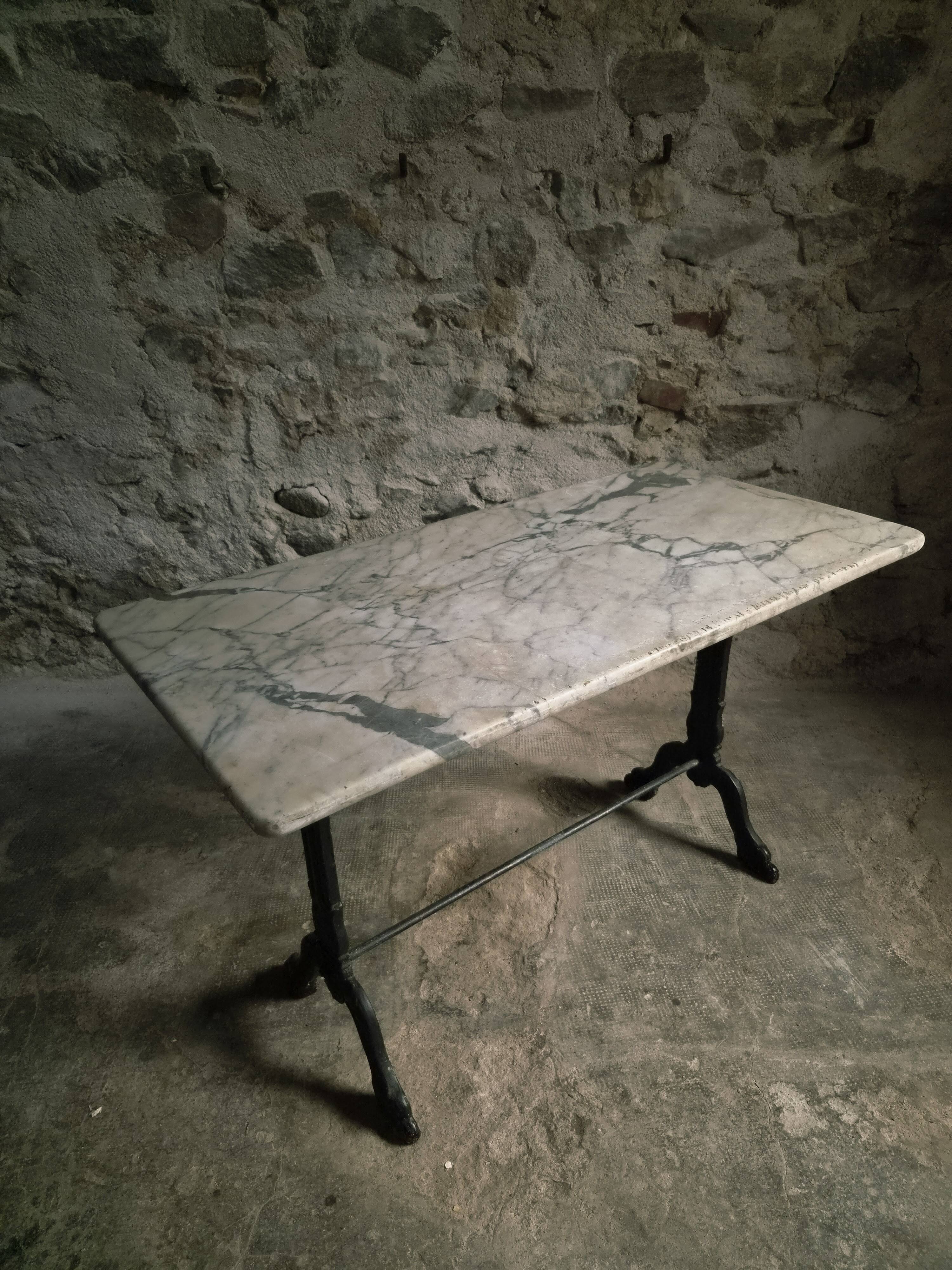 French bistro table made of marble with a cast iron base, 1920s–1930s.