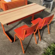Vintage orange double school desk with its 2 matching chairs.
