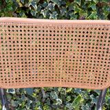 Wooden chair with caning in the style of Marcel Breuer.