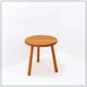 Vintage solid wood side table with rounded legs.