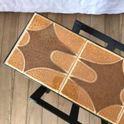 Magazine rack in ceramic and black, orange and brown iron from the 70s