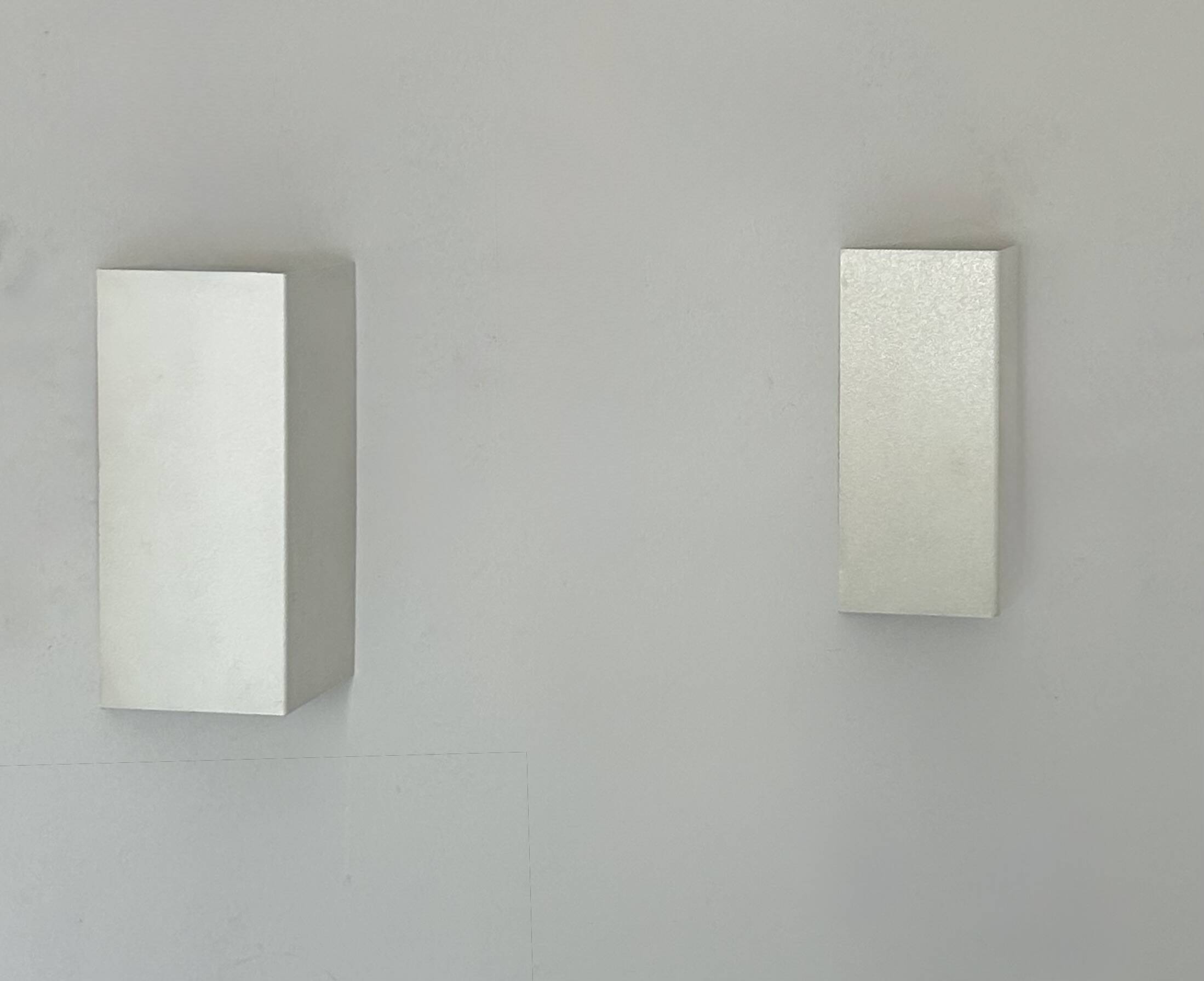 Pair of vintage wall lights, matte white metal, France 1970.