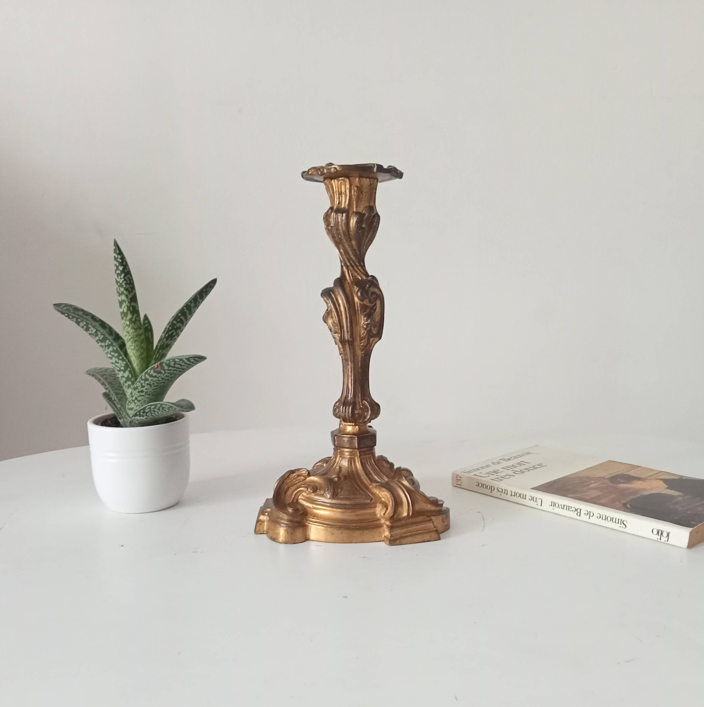 Antique 19th-century solid gilded bronze candlestick in the Louis XV style.