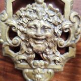 Pair of gilded bronze sconces decorated with Louis XIV style mascarons