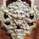 Pair of gilded bronze sconces decorated with Louis XIV style mascarons