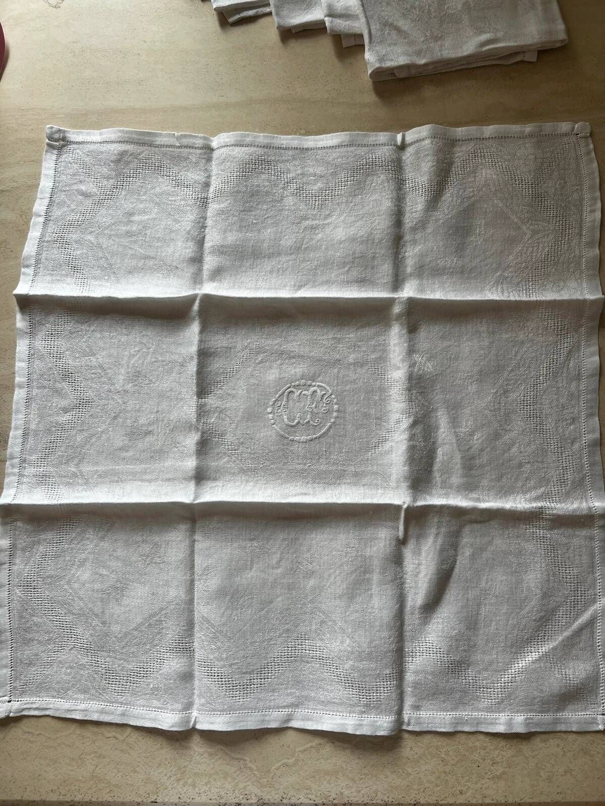 Set of six antique damask napkins with embroidered monogram.
