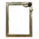 Vintage wall mirror in varnished steel decorated with a rose in relief