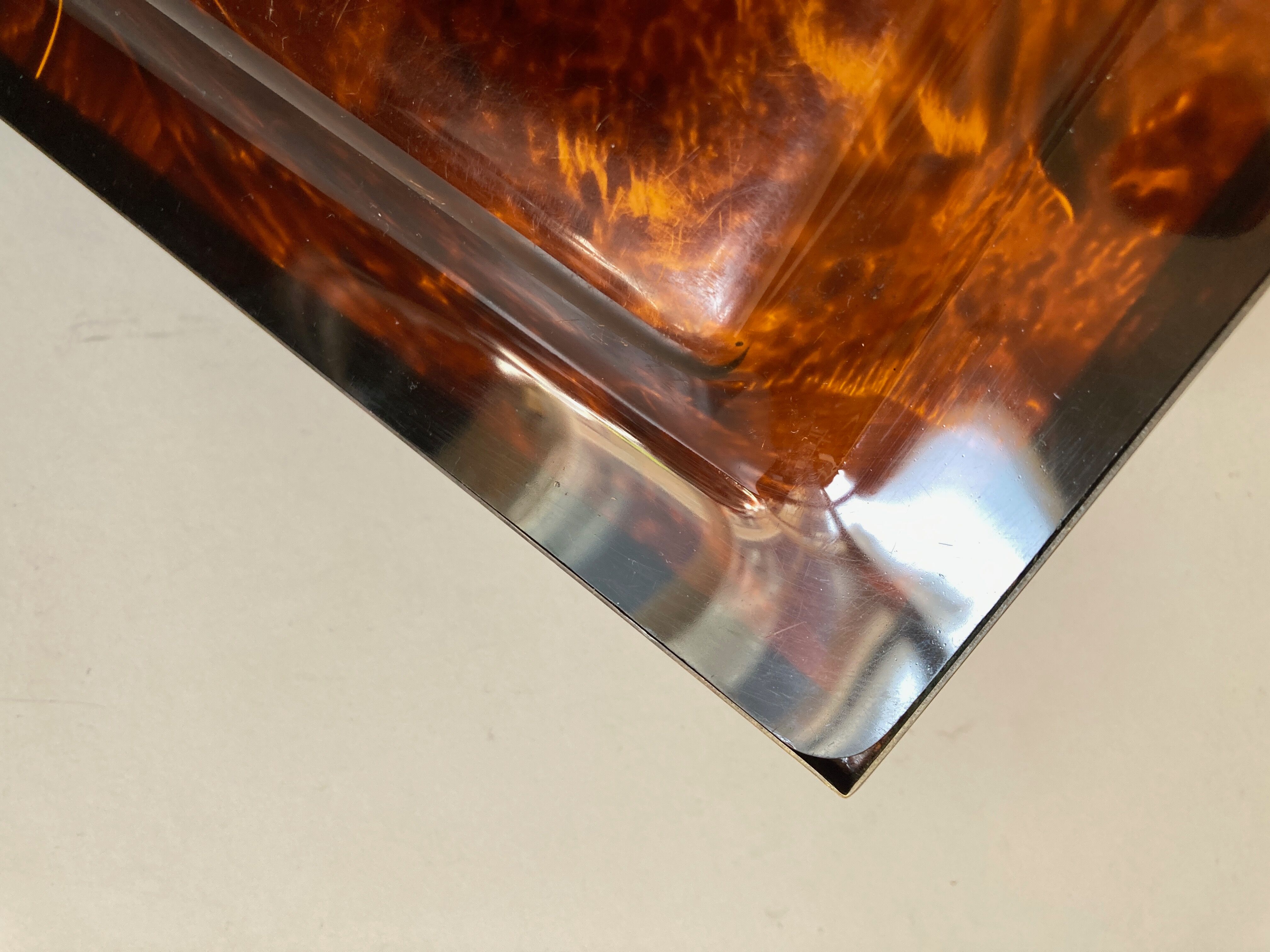 Plate of lucite scale and patinated brass