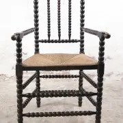 Black bobbin chair with armrests and rush seat – ca. 1900-1930