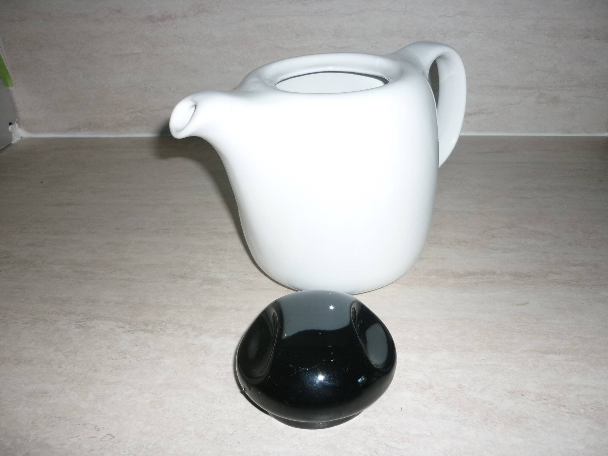 Black and white ceramic coffee maker