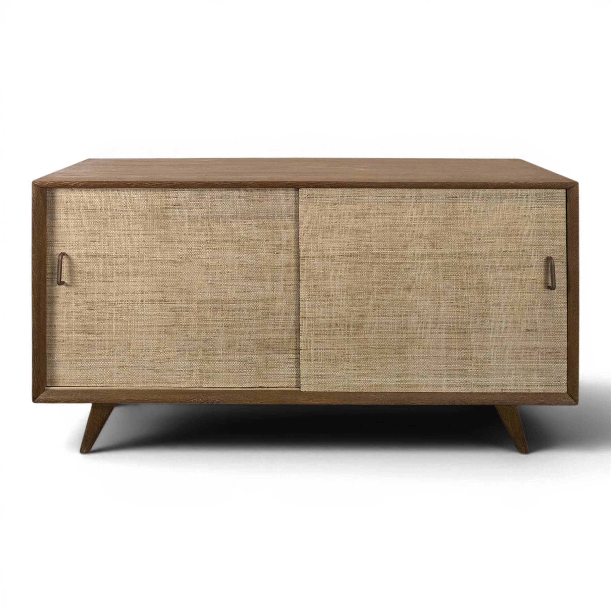 Modernist sideboard in oak with rattan doors.